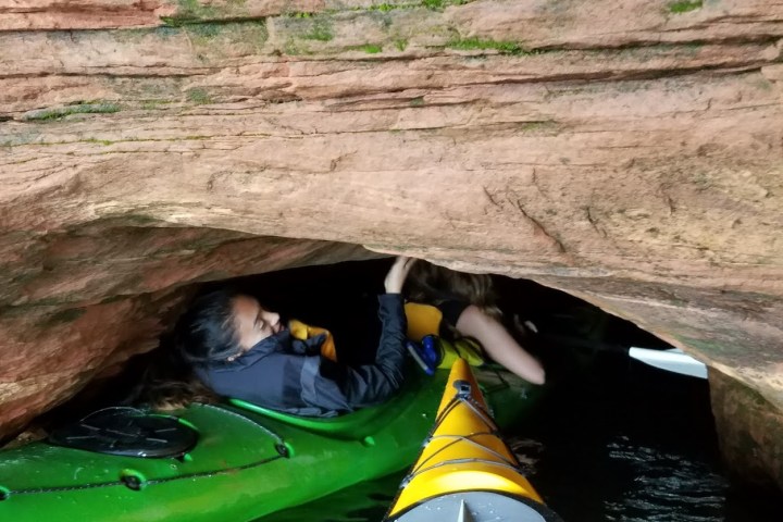 Having to lean back in a kayak to fit under the overhang