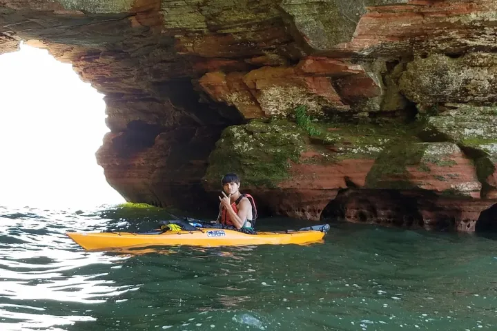 A man posing in a kayak at Meyers beach