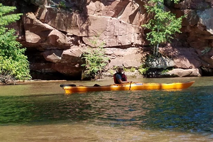 A man kayaking near apostle island