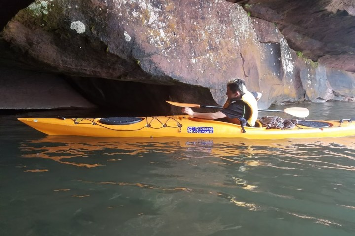 Kayaking through the ice caves at red cliff caves
