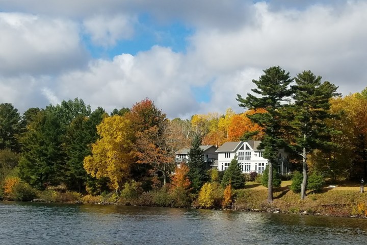 A white house near the edge of the water
